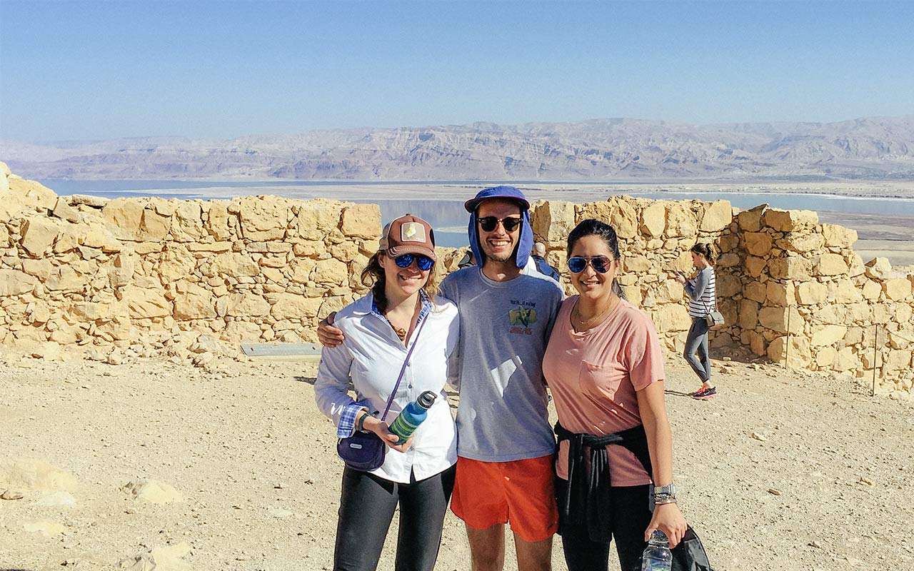 Philadelphia Birthright Israel alumna Alix Ablaza on top of Masada with her group 